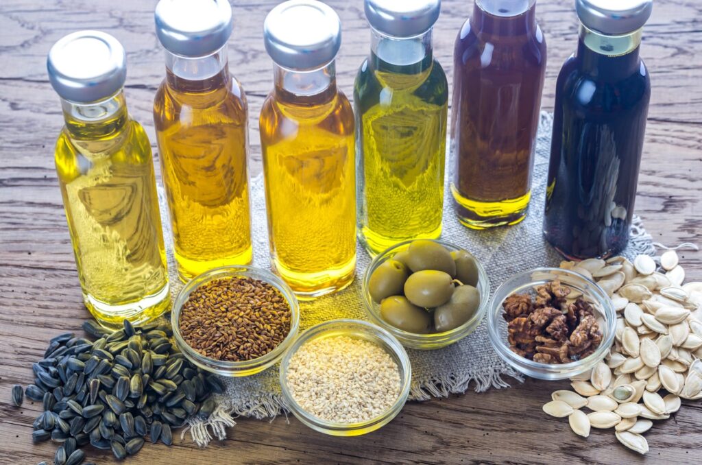 a group of bottles of oil and seeds