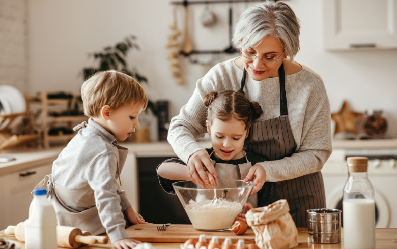 a woman and kids making a cake